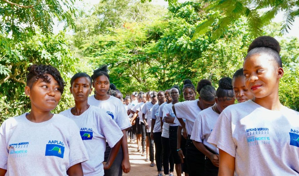 Graduates process in to the July 2025 Family Graduation Celebration on Lagonav Island.
